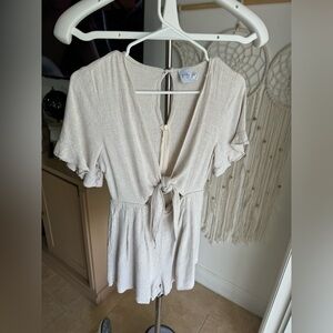 Light beige ruffled front tie romper